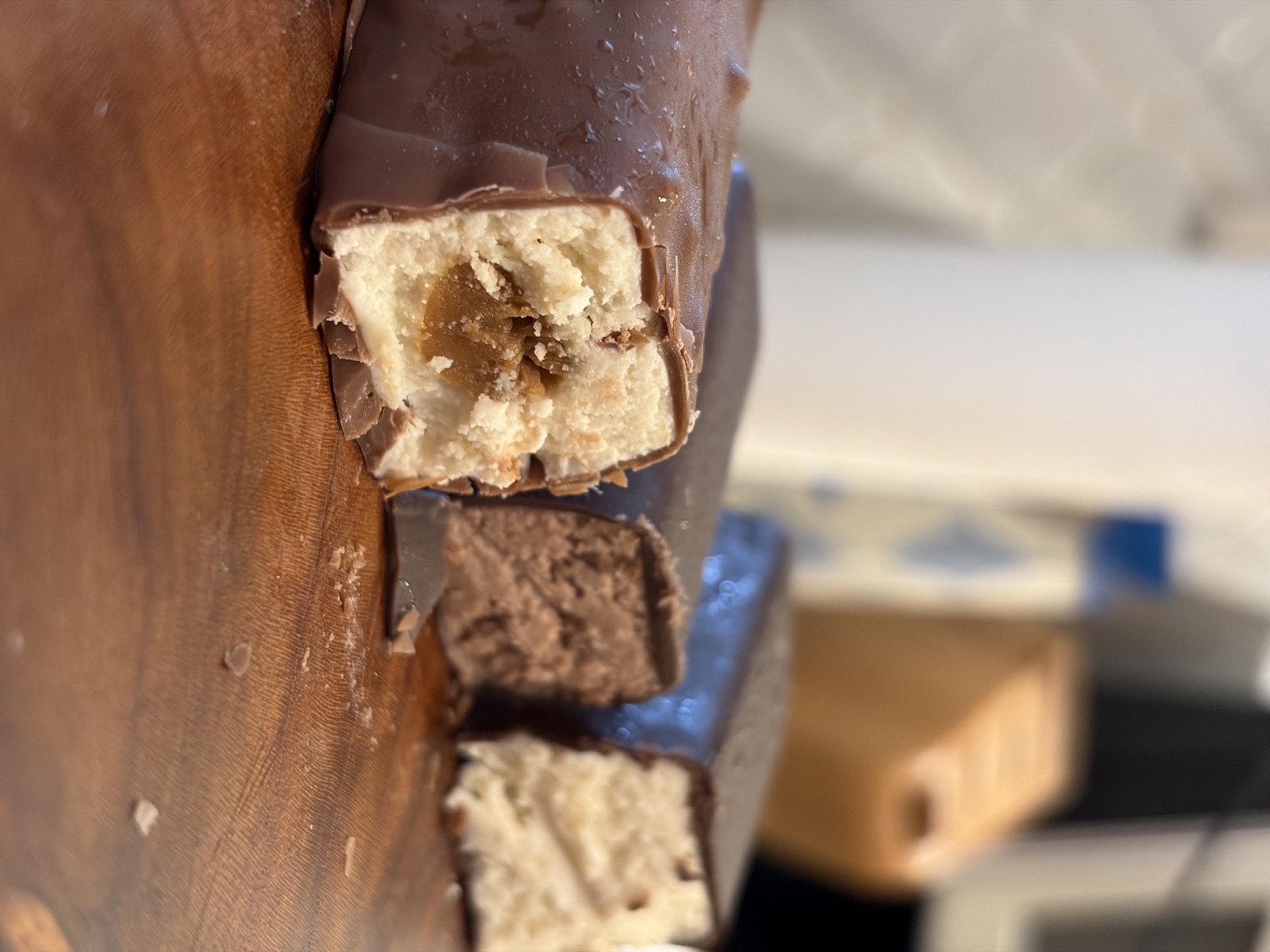 Three Dairy Velvet bars cut open on a wooden board
